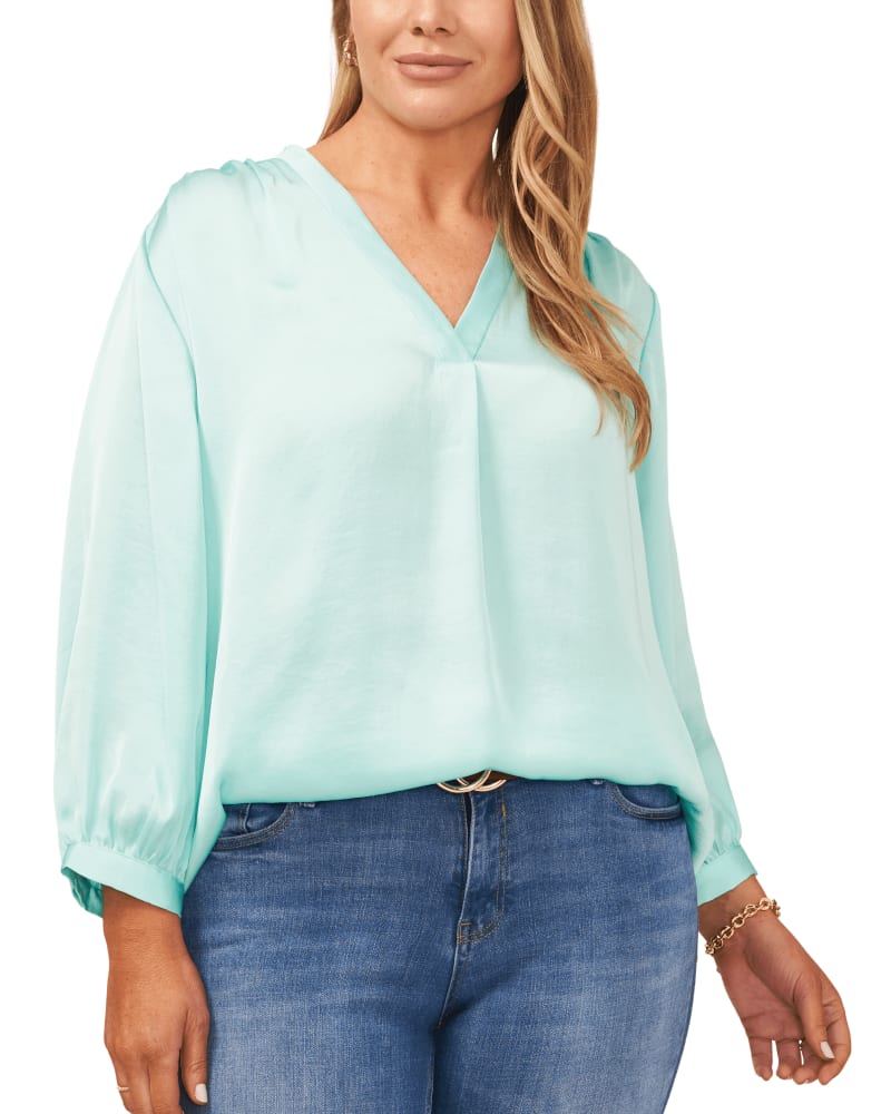 Front of a model wearing a size 1X Aurora V-Neck Blouse in COOL WATERS by Vince Camuto. | dia_product_style_image_id:260851